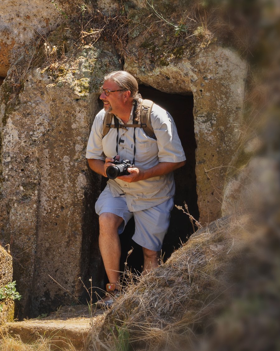 René van Bakel exiting an Etruscan tomb at Banditaccia, Cerveteri